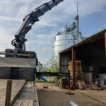 Kettingtransporteur van Jansen en Heuning voor horizontaal en licht opwaarts transport van bulkgoed.